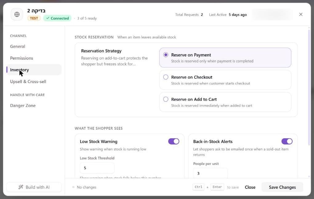 A sales channel's Inventory settings tab showing the Reservation Strategy choices and, under What the shopper sees, the Low Stock Warning switch with its Low Stock Threshold of 5 and the Back-in-Stock Alerts switch