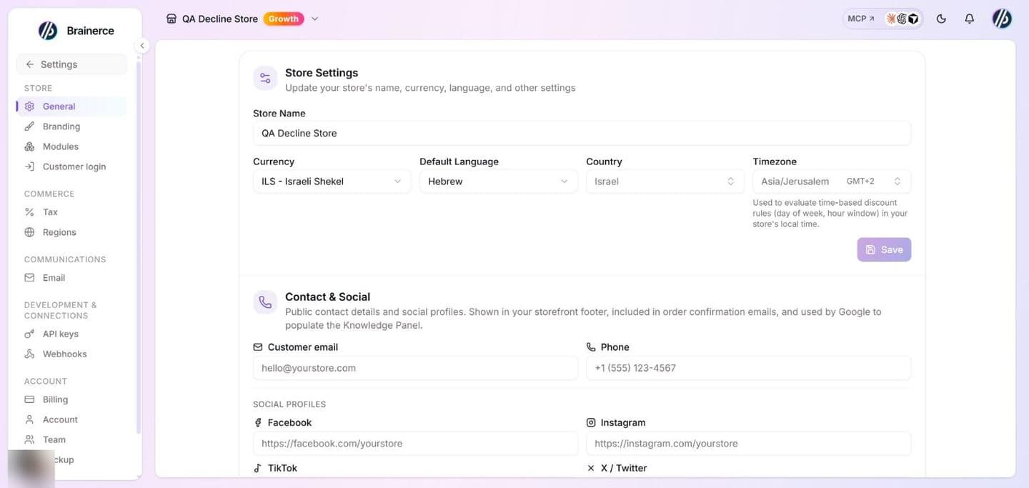 The General settings page: the Settings sidebar on the left, then the Store Settings section (Store Name, Currency, Default Language, Country, Timezone and a Save button) with the Contact & Social section starting below it (Customer email, Phone and the social profile links)