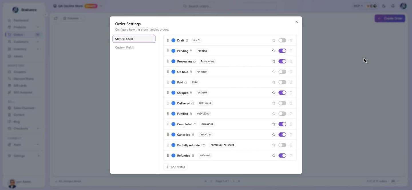The Order Settings dialog on the Status Labels tab, listing the twelve built-in statuses (Draft, Pending, Processing, On hold, Paid, Shipped, Delivered, Fulfilled, Completed, Cancelled, Partially refunded, Refunded), each with a drag handle, a color dot, a lock icon, its name, a star for the default new-order status, a visibility switch and a disabled delete button, with an Add status button below and a Custom Fields tab in the side list
