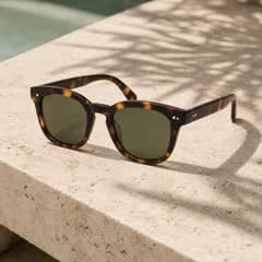 AI product photo: tortoiseshell sunglasses on a sunlit stone ledge